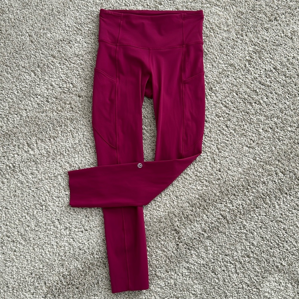 Lululemon Wildberry Tights with 5 separate waist pockets, and phone pockets